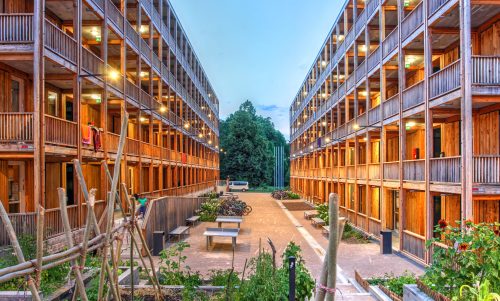 Centre Rigot, a collective accommodation center inaugurated in 2019 in Geneva, Switzerland and built entirely of wood close to the Place des Nations at sunset.